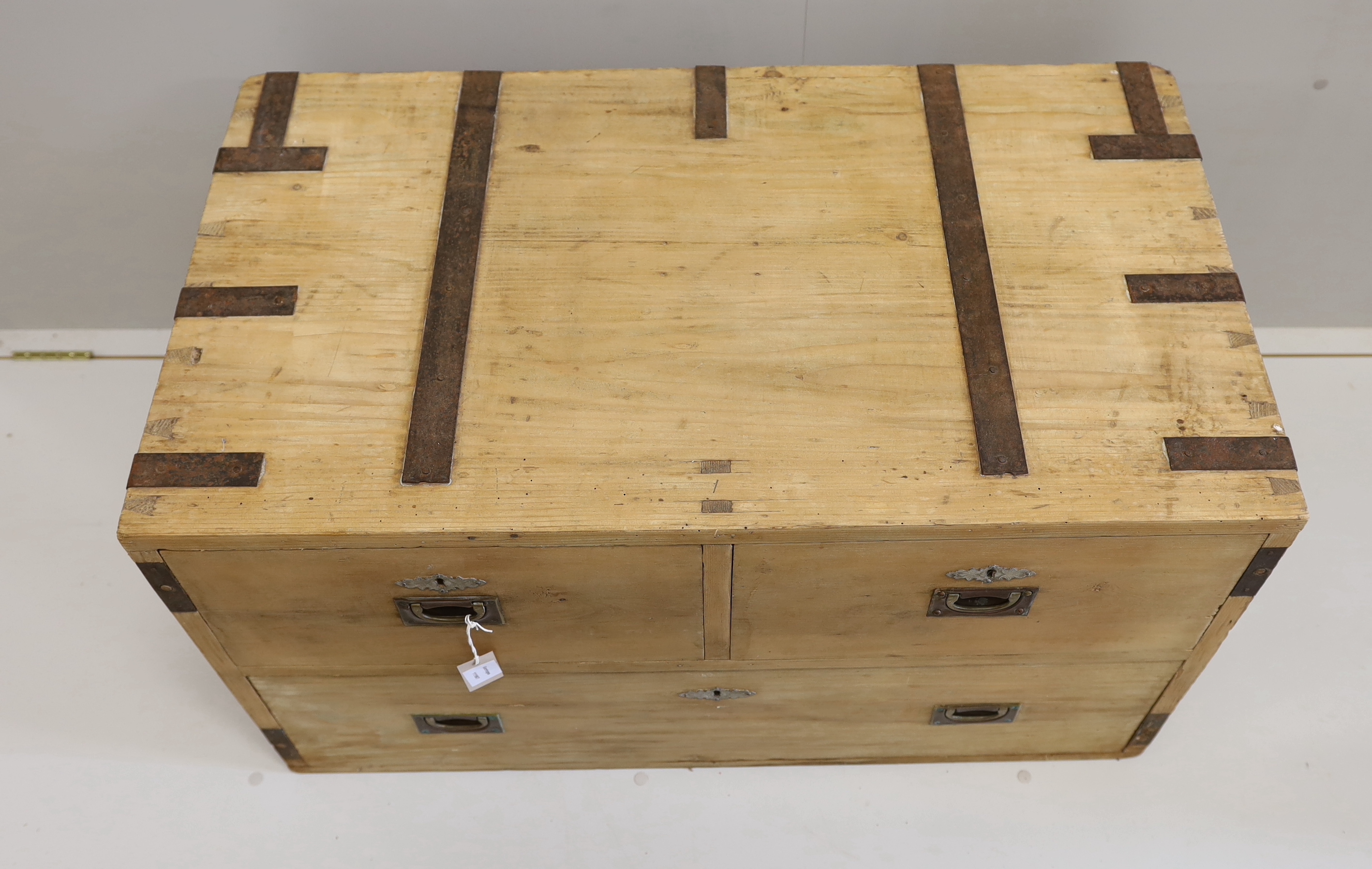 A 19th century iron bound pine three drawer low chest, width 96cm, depth 54cm, height 56cm